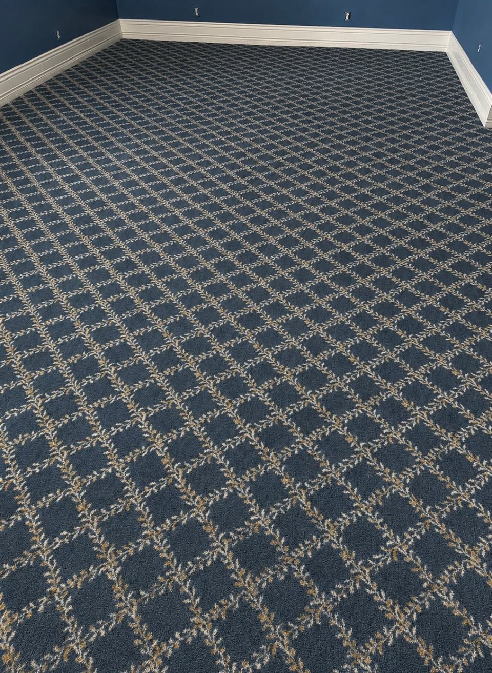 Navy Milliken carpet with a cream diamond lattice pattern, in a historic Louisville home.