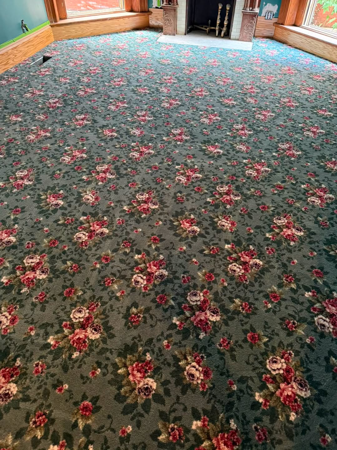 Milliken rose-pattern carpet in a sitting room of a historic home in downtown Louisville.