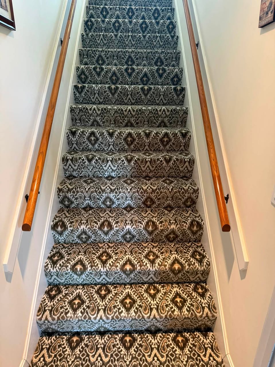 Milliken Artisan patterned carpet in the color Olive Wood on a long staircase.