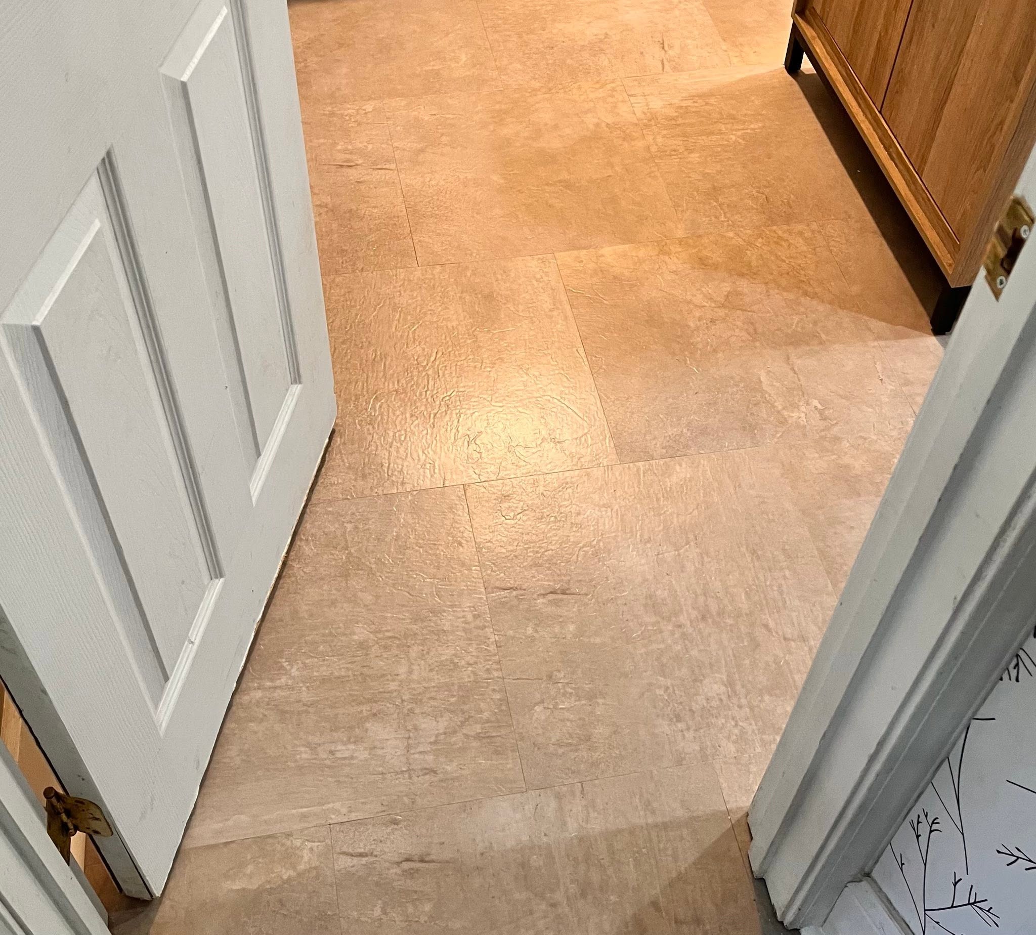 Tarkett InStudio luxury vinyl tile in a warm terracotta tone.