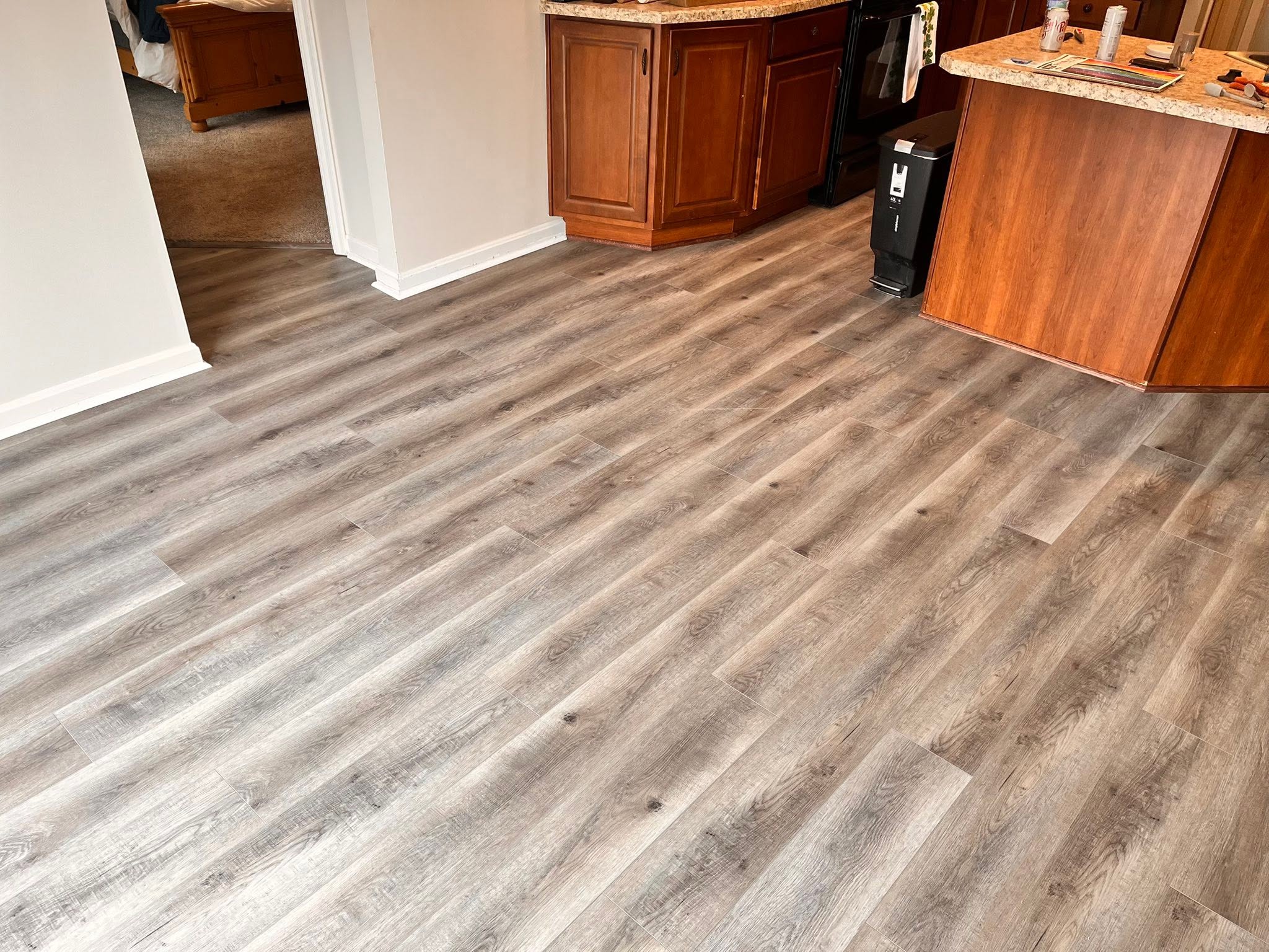 True Touch Hawaii Collection flooring in the color Tiki, in a kitchen and dining area.