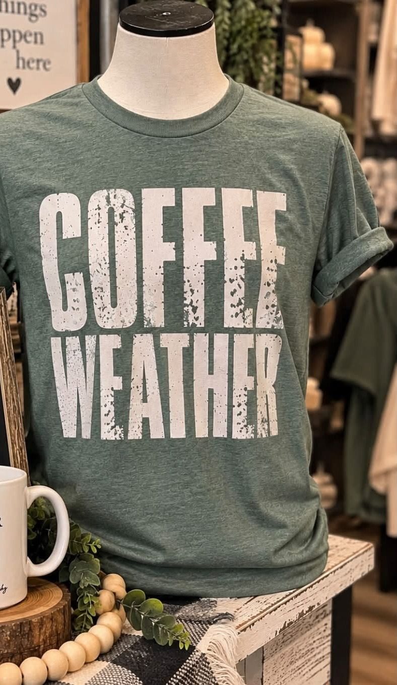 A Coffee Weather graphic t-shirt on display.